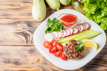 Chopped steak cutlet cooked on grill on white plate
