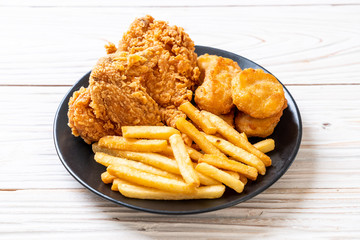 fried chicken with french fries and nuggets meal