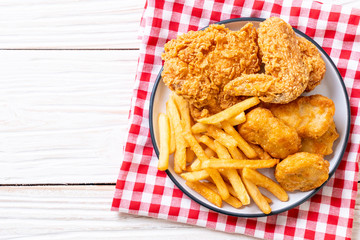 fried chicken with french fries and nuggets meal
