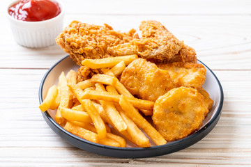 fried chicken with french fries and nuggets meal