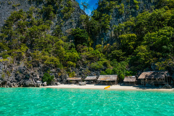 Little houses on a beach in the Philippines