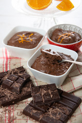 close up of dark chocolate mousse with tablets