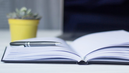 laptop and documents in the workplace.