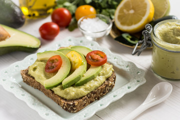 Healthy Breakfast with Fresh Avocado Spread Guacamole on Slice of Bread