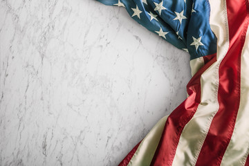 Close-up american flag on white marble background