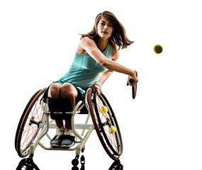 Fototapeta premium one caucasian young handicapped basket ball player woman in wheelchair sport tudio in silhouette isolated on white background