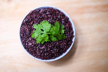 Obraz na płótnie Canvas Cooked Thai black jasmine rice berry