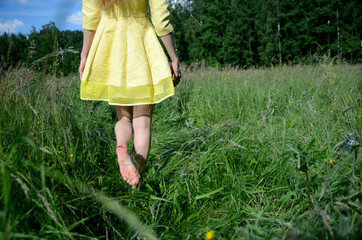 Yellow dress and barefoot
