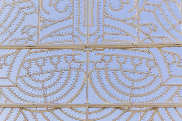 metal construction with led lights for illuminating decoration at night against blue sky