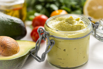 Vegan Raw and Healthy Food Concept. Homemade Avocado Spread Guacamole in Jar.