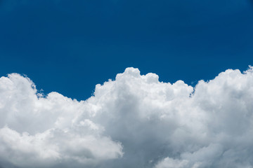Naklejka na ściany i meble Closeup white cumulus cloud with blue sky for nature background
