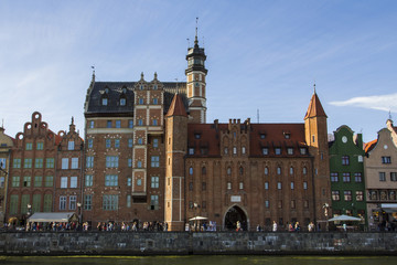 Ancient colored houses on the promenade of the river in Gdansk