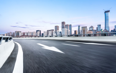empty asphalt road with modern office building