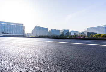 empty asphalt road with modern office building