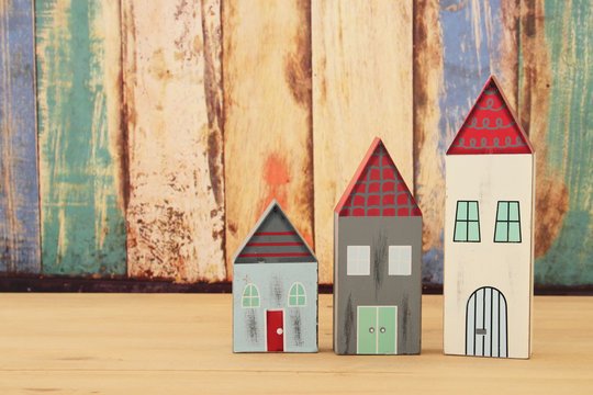 image of vintage wooden colorful houses decoration on wooden table.