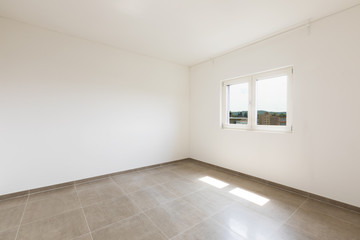 Empty room in a modern apartment with white walls, nobody in the scene