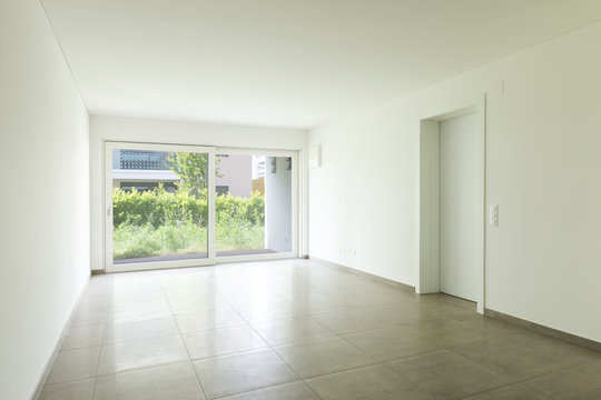 Empty room in a modern apartment with white walls, nobody in the scene
