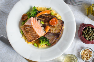 Grilled Salmon Fillet with Vegetables on White Plate