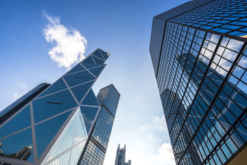 Fototapeta na wymiar up view of modern glass building in hongkong china