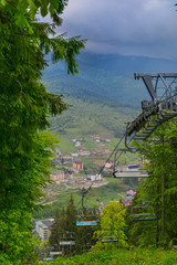 Emtpy chairlift in ski resort. Shot in summer with green grass and no snow