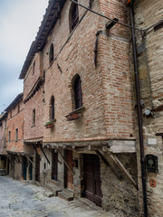 Fototapeta na wymiar Medieval homes built on the city walls in Cortona, Tuscany