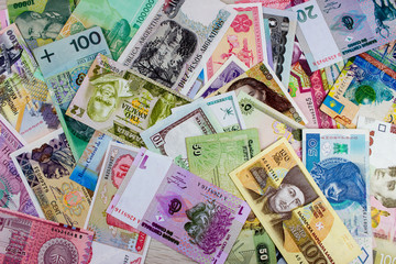 Obraz na płótnie Canvas Different Worlds banknotes pattern. Money concept. Texture for bussines