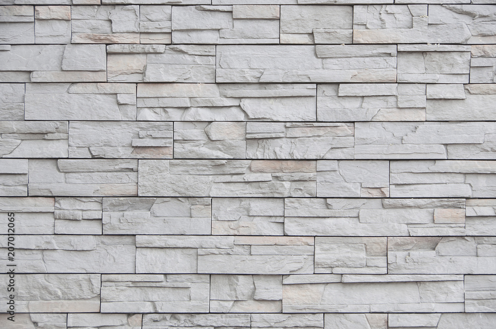 Wall mural modern brick wall, slab stone pattern as background.