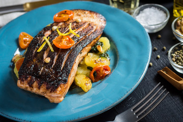 Crispy Skin Grilled Salmon with Vegetables on Blue Plate