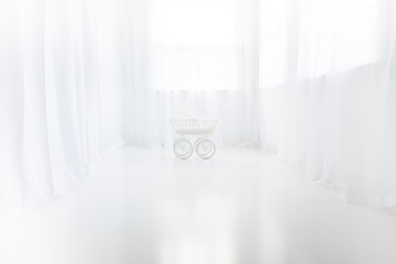 White Studio Room With Curtains and Pram