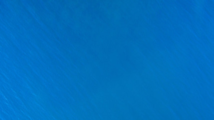 Top-down drone view of the texture of water in the sea
