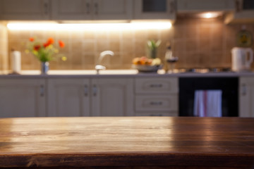 blurred kitchen interior with wooden desk space