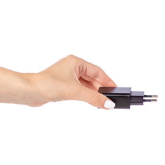 Charger for mobile phone in hand on white background isolation