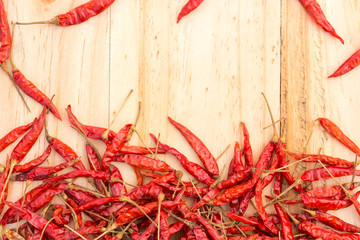 Dried chillies on wooden floor