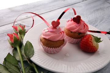 Delicious cupcake for Valentine Day. cake for Valentines day with chocolate and strawberries. Traditional homemade with red roses