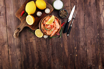 Raw fresh Prawns Langostino Austral. shrimp seafood with lemon and spices.