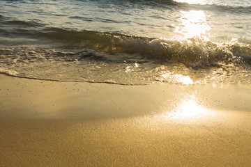 Beautiful golden sunrise in the sea. Reflection in the water. Beautiful Nature background.