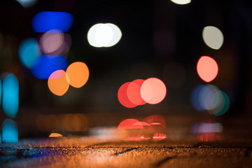 Light bokeh dots in the night after rain.