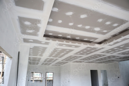 Ceiling Gypsum Board Installation At Construction Site