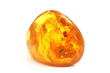 Amber. Transparent beautiful and bright piece of yellow amber amber on a white background. A sunny...