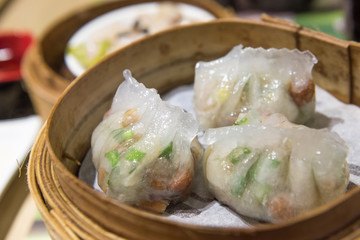 Dim Sum, traditional Cantonese dumplings, cooked in bamboo steamer