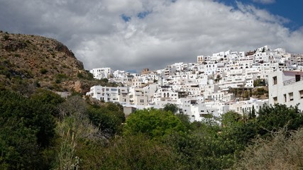 Fototapeta na wymiar White spanish village perched on the slope of a hill