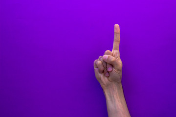 One counting right hands isolated on purple background