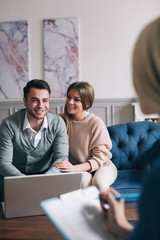 Family meeting real-estate agent for house investment.