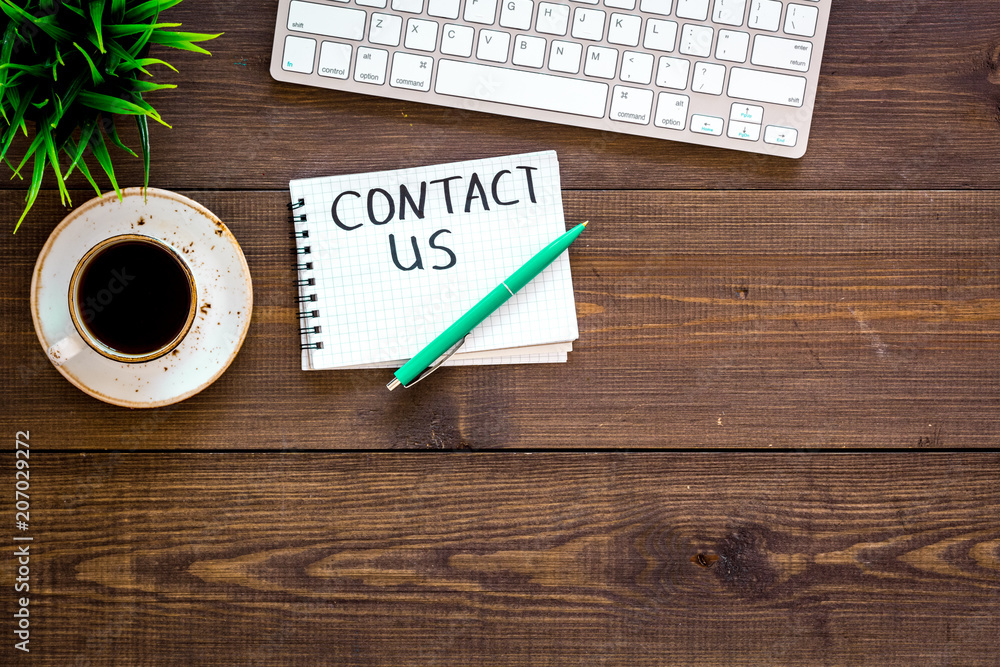 Poster template for contacts, background for contact information. lettering contact us in notebook on offic