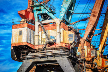 Old rusty abandoned port cranes