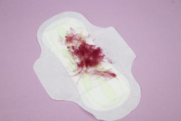 Medical conception photo. Red dreamy smile crochet blood drop, daily and menstrual pad and tampon, Woman critical days, gynecological menstruation cycle, Menstruation sanitary woman hygiene