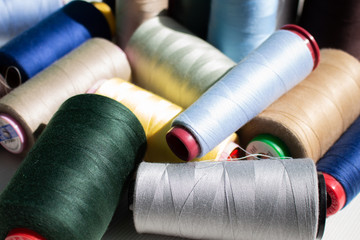 A set of colorful threads for sewing. Close up