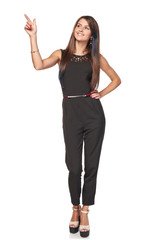 Obraz premium Happy business woman pointing to the side at blank copy space, full length portrait, over white background