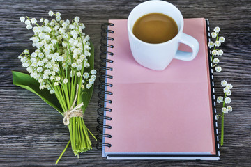 Notebook,Fresh Flower and  Cup of Coffee .Spring Morning Concept with Copy Space 