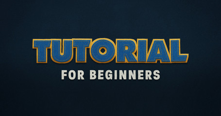 Tutorial for beginners. Blue word with yellow contour on blue background with textile texture. 